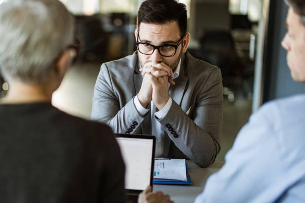 Worried businessman during a meeting with his colleagues in the office